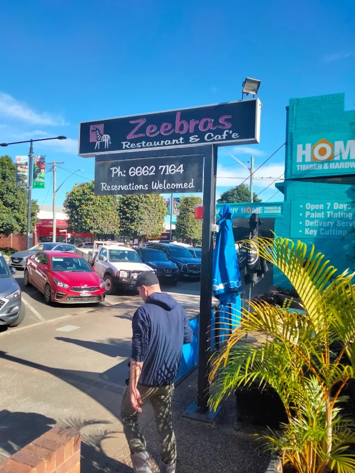 The Zeebras street sign in pink script